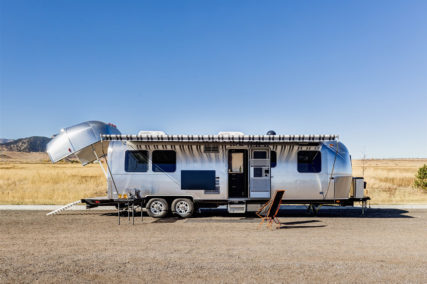An exterior view of the Airstream Toy Hauler with open back end.